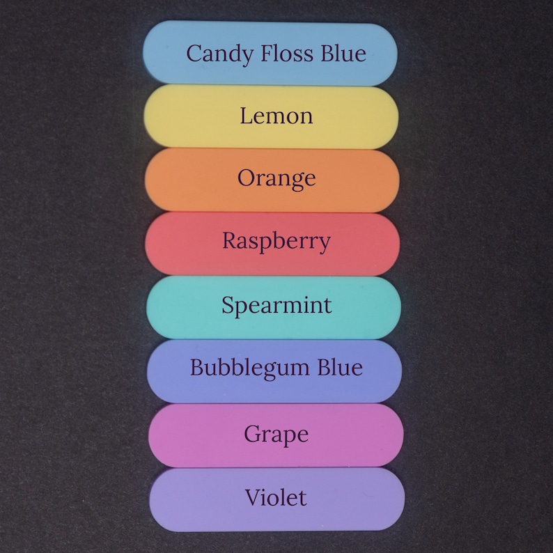 May include: Eight colorful, rectangular, plastic sticks with different flavor names written on them. The flavors are Candy Floss Blue, Lemon, Orange, Raspberry, Spearmint, Bubblegum Blue, Grape, and Violet.