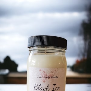 Black Ice candle, made with all-natural soy wax and premium fragrance oils. The  scent of lemon, eucalyptus, and mint, with mid notes of lavender, clove, and jasmine. The candle has a robust and earthy base of vetiver, cedarwood, and oakmoss.