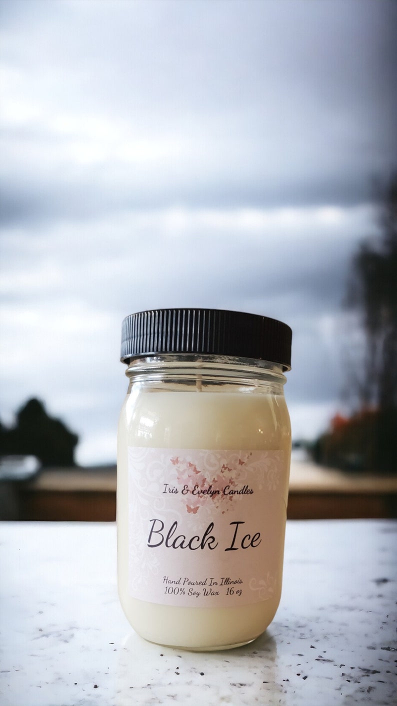 Black Ice candle, made with all-natural soy wax and premium fragrance oils. The  scent of lemon, eucalyptus, and mint, with mid notes of lavender, clove, and jasmine. The candle has a robust and earthy base of vetiver, cedarwood, and oakmoss.