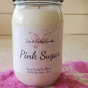 Pink Sugar candle, made with all-natural soy wax and a cotton wick for a clean and long-lasting burn.  A fragrance oil with notes of cotton candy, bergamot, Sicilian orange, and fig leaves. With mid notes of licorice blossom and lily of the valley.