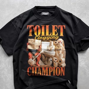Maglietta da campione di intasamento del gabinetto, maglietta divertente per gli amanti del gabinetto, maglietta con meme e scherzi, maglietta grafica con meme, maglietta brutta, maglietta scherzosa, regalo divertente