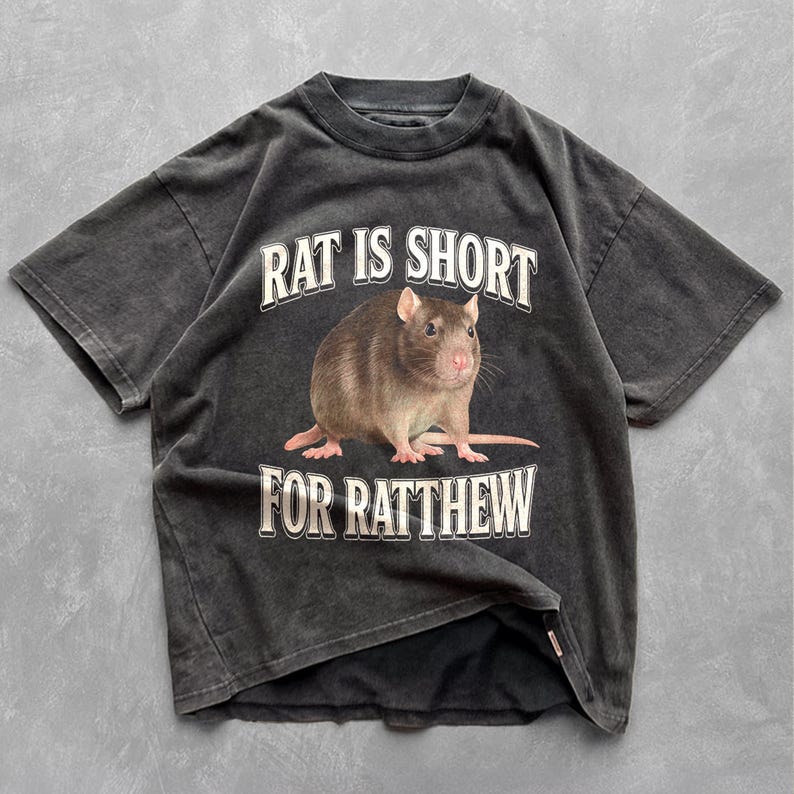 May include: A black t-shirt with a rat graphic and the text "Rat is short for Ratthew".