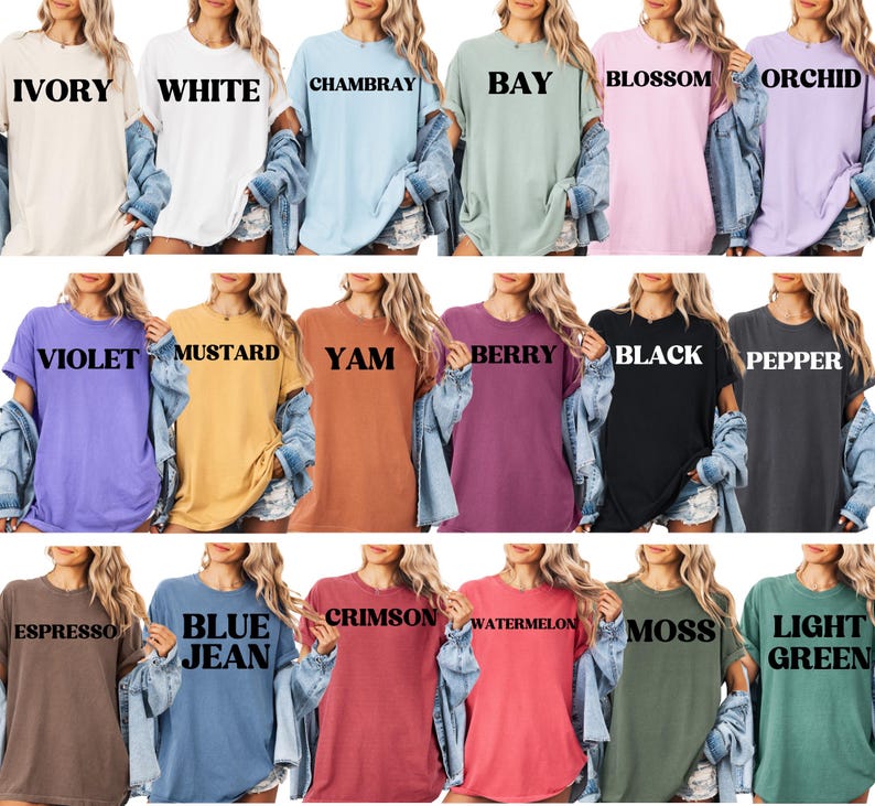 May include: A collection of 18 oversized t-shirts in various colors, each with a different color name printed on the front. The colors include Ivory, White, Chambray, Bay, Blossom, Orchid, Violet, Mustard, Yam, Berry, Black, Pepper, Espresso, Blue Jean, Crimson, Watermelon, Moss, and Light Green.