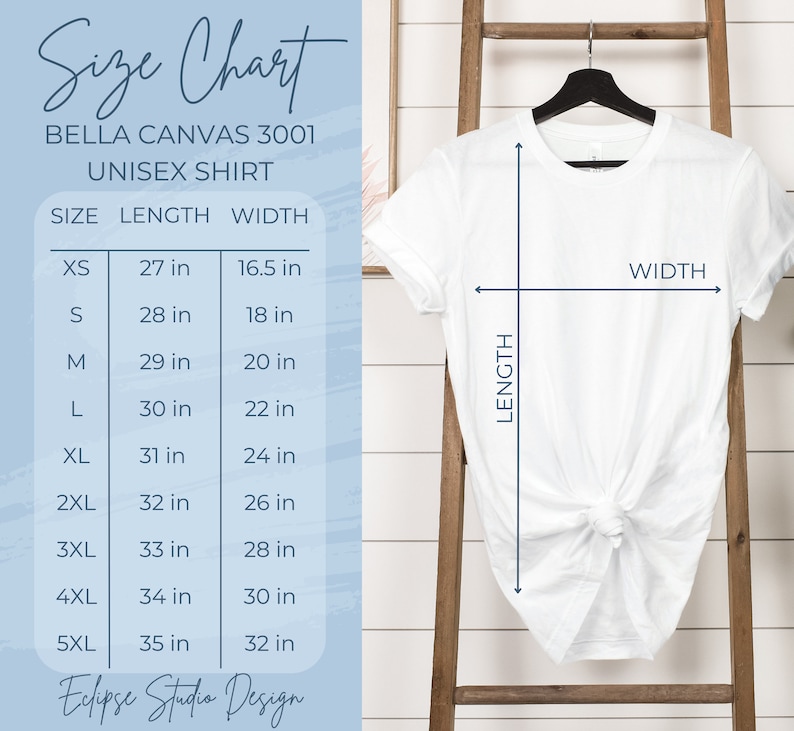 May include: White Bella Canvas 3001 unisex shirt on a black hanger. The image includes a size chart with measurements in inches for sizes XS to 5XL. The chart shows length and width measurements for each size. The text "Eclipse Studio Design" is at the bottom.