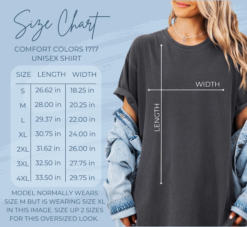 May include: Size chart for a unisex t-shirt in Comfort Colors 1717. The chart shows the length and width measurements in inches for sizes S, M, L, XL, 2XL, 3XL, and 4XL. The model is wearing a size XL t-shirt, which is two sizes larger than their usual size M. The text reads "Model normally wears size M but is wearing size XL in this image. Size up 2 sizes for this oversized look."