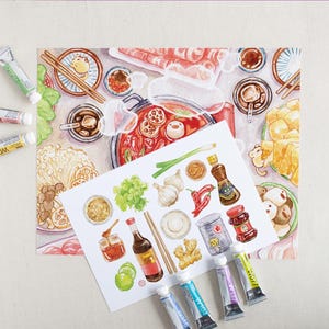 May include: A watercolour painting of a hot pot meal with various ingredients, including mushrooms, noodles, garlic, chilli peppers, and sauces. The painting is surrounded by paint tubes.