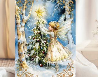 May include: A rectangular print featuring a fairy with translucent wings placing a gold star atop a snow-covered Christmas tree. The scene is set in a winter forest with birch trees, framed by an ornate gold border on a deep blue background.