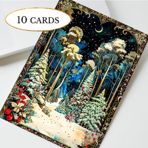 May include: A rectangular greeting card featuring a winter forest scene with snow-covered pine trees, red berries, and a crescent moon in a dark starry sky. The card is framed by an ornate gold border and includes the text 10 CARDS in an oval.