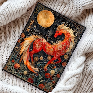 May include: A decorative journal with a striking red horse design and gold detailing, set against a dark backdrop with a full moon. The journal incorporates floral and celestial motifs, and the text "星年大吉" is visible.