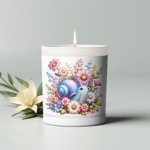 May include: A white candle with a blue and pink snail surrounded by flowers. The snail is on a white background with a black border.