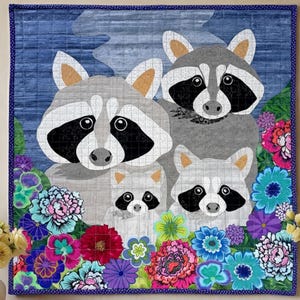 May include: A fabric wall hanging depicting a family of raccoons amidst vibrant flowers. The raccoons have distinctive black and white facial markings and grey fur. The flowers are in shades of pink, blue, purple, and red.