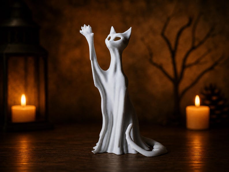 The tall reaching ghost cat statue, standing elegantly on a rustic wooden surface, making a unique and eerie shelf sitter for the spooky season.