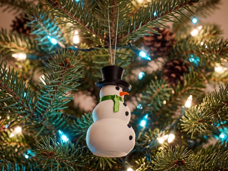 The snowman ornament glowing against a Christmas tree strung with icy blue fairy lights, its pitted snow-white body catching the soft winter light.