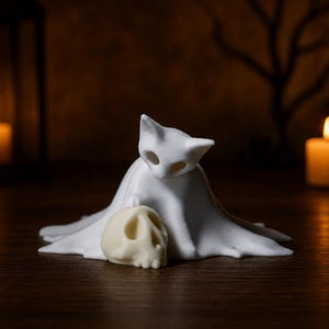 An eye-level close-up of the creepy cute kitten ghost statue looking at a skull, serving as a macabre feline accent for an October aesthetic.