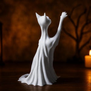 The rear view of the reaching ghost cat statue, showing the details of its spectral sheet. This eerie shelf sitter rests on a rustic wood surface.