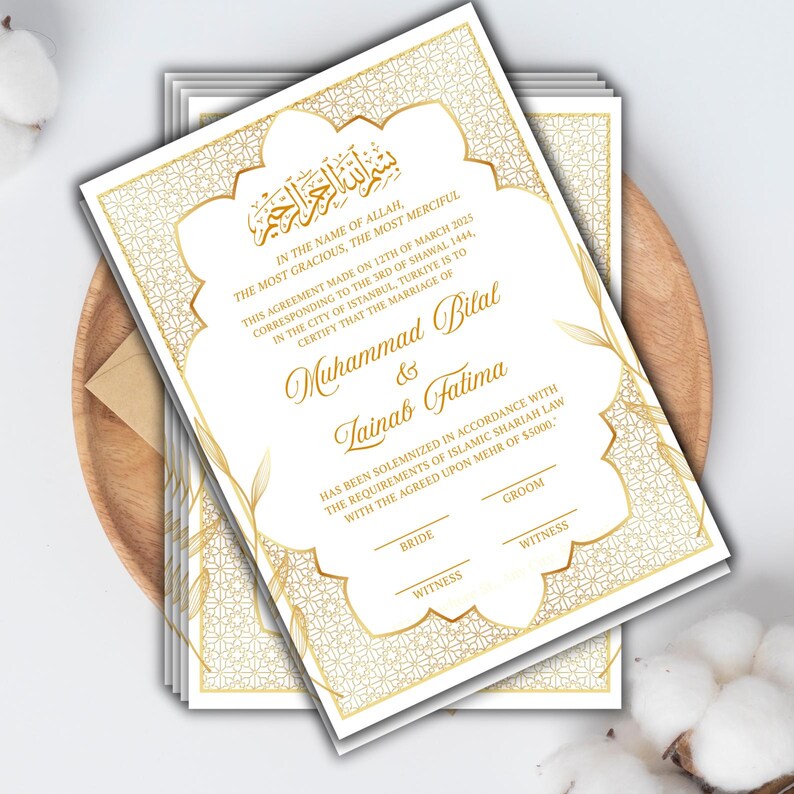 May include: Wedding invitation with gold detailing on a white background. The design includes ornate borders and Arabic calligraphy. The names Muhammad Bilal & Tainab Fatima are displayed, along with the date and location of the ceremony.