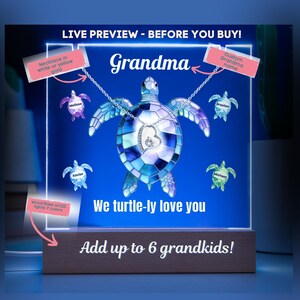 May include: A personalised gift for Grandma, featuring a turtle-shaped necklace with a heart pendant. The design includes the text "Grandma" and "We turtle-ly love you." It has a wooden base with the text "Add up to 6 grandkids!"