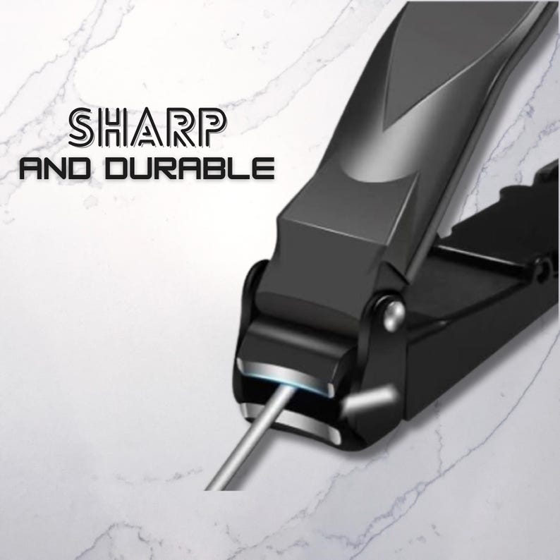 Puede incluir: Cortau&ntilde;as negro con una lima de u&ntilde;as plateada. Las tijeras tienen un dise&ntilde;o elegante y moderno con las palabras "SHARP AND DURABLE" en texto blanco. Las tijeras est&aacute;n sobre una superficie blanca y gris similar al m&aacute;rmol.