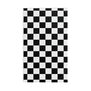 May include: Black and white checkered pattern on a fabric surface. The pattern is a classic checkered design, with alternating black and white squares.