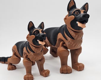 May include: Two articulated German Shepherd dog figurines, one larger than the other. Both are brown and black with a realistic appearance.