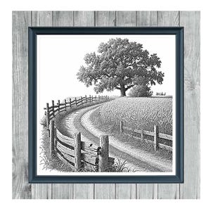 May include: Monochrome cross stitch pattern titled "Dirt Road 2." The artwork depicts a winding dirt road bordered by a wooden fence, leading towards a large tree. The image is framed in a dark blue frame, set against a gray wood-grain background.