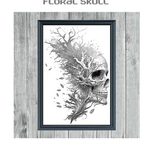 May include: Black and white cross stitch pattern of a skull with a tree growing out of it. The pattern is titled "Floral Skull" and "Monochrome Cross Stitch Pattern".