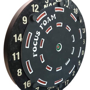 May include: A black dartboard with white numbers and a red and white foam target with the text "FOCUS FOAM" printed on it.