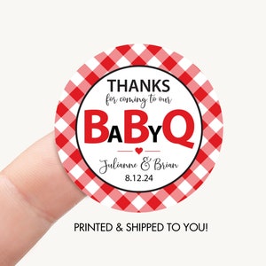 May include: Red and white gingham patterned circle sticker with the text "THANKS for coming to our BABYQ Julianne & Brian 8.12.24" printed in black.