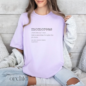 May include: A lavender t-shirt with the text "momcreas /mom-kree-us/ noun Like a pancreas, but gets the job done. see also insulin dealer, superhero" printed on the front.