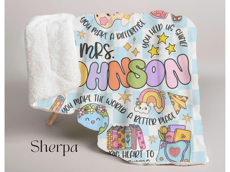 May include: A blue and white sherpa blanket with a colorful design featuring the text "You make a difference Mrs. Johnson You make the world a better place Big heart to learning" and various illustrations including stars, rainbows, pencils, books, and a globe.