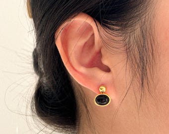 Black Stone Drop Studs with a Gold Oval Frame in a Classic Minimalist Modern Style