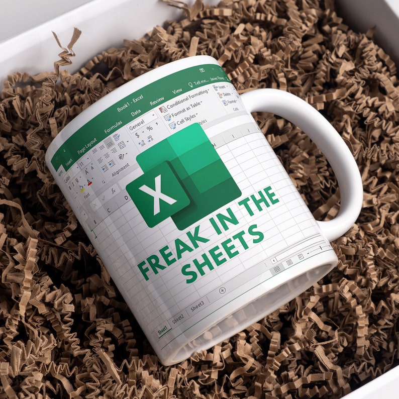 White ceramic 11oz Freak In The Sheets Excel mug with a graphic showing an Excel spreadsheet and the words Freak in the sheets. Perfect funny gift for a coworker, boss and friend.