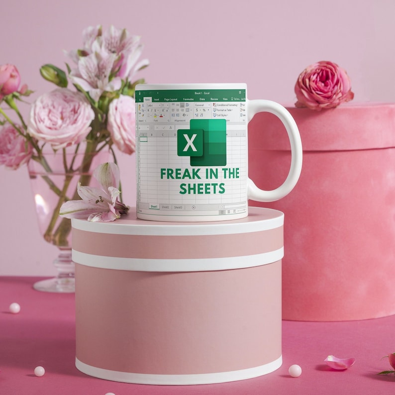 White ceramic 11oz Freak In The Sheets Excel mug with a graphic showing an Excel spreadsheet and the words Freak in the sheets. Perfect funny gift for a coworker, boss and friend. Perfect spicy Valentines Day Gifts!