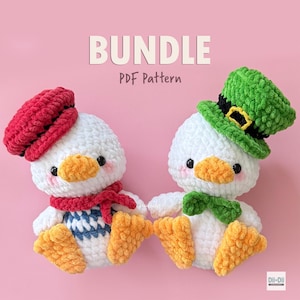 May include: Two crocheted duck dolls with white bodies, orange beaks and feet, and black eyes. One duck wears a red beret and scarf, the other a green hat and bow tie. The word "BUNDLE" and "PDF Pattern" are displayed on a pink background.