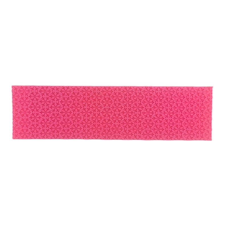 May include: A pink silicone rolling pin with a snowflake pattern embossed on the surface.