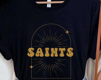 Celestial Saints Tee | Retro Geaux NOLA Black and Gold NFL T-shirt | New Orleans Louisiana Team Sports Fan LA Football Shirt