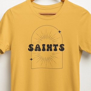 Celestial Saints Tee | Retro Geaux NOLA Gold and Black NFL T-shirt | Vintage Aesthetic New Orleans Louisiana Football Team Tshirt | Game Day