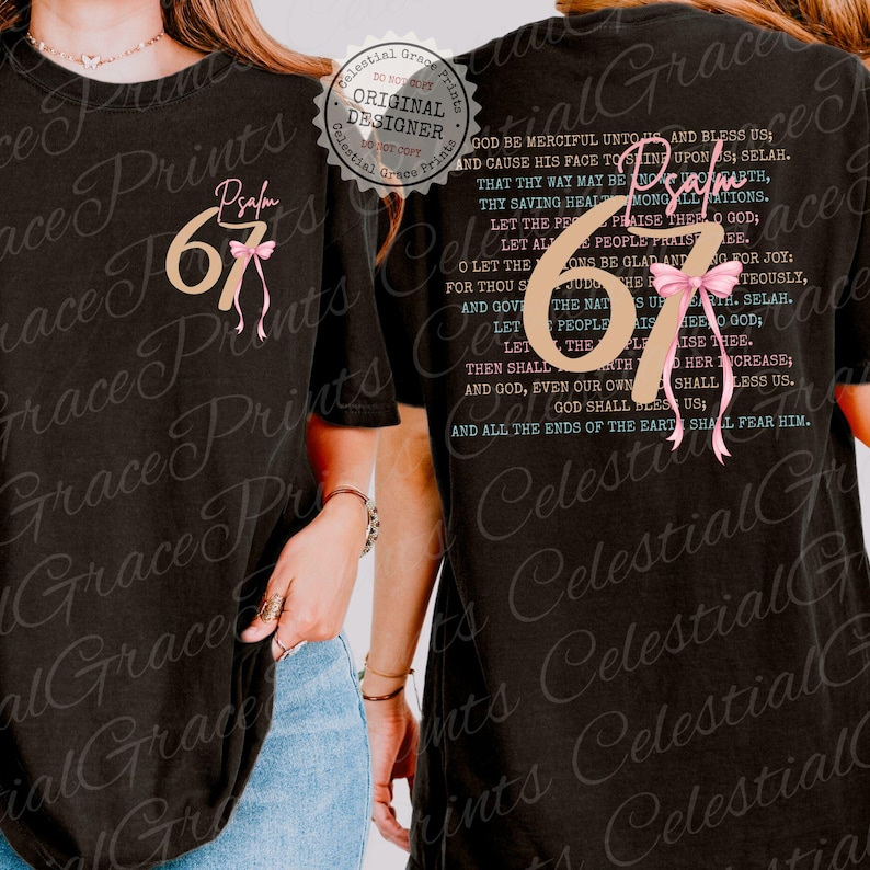 May include: Black t-shirt with the text "Psalm 67" in a gold font, accented with a pink bow. The back of the shirt features the full text of Psalm 67 in a teal font. The shirt is a casual wear item.