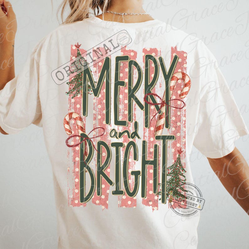May include: An off-white short-sleeve t-shirt featuring a back graphic with the text MERRY and BRIGHT in dark green. The design includes red and white striped candy canes, green Christmas trees, and vertical red polka-dot stripes.