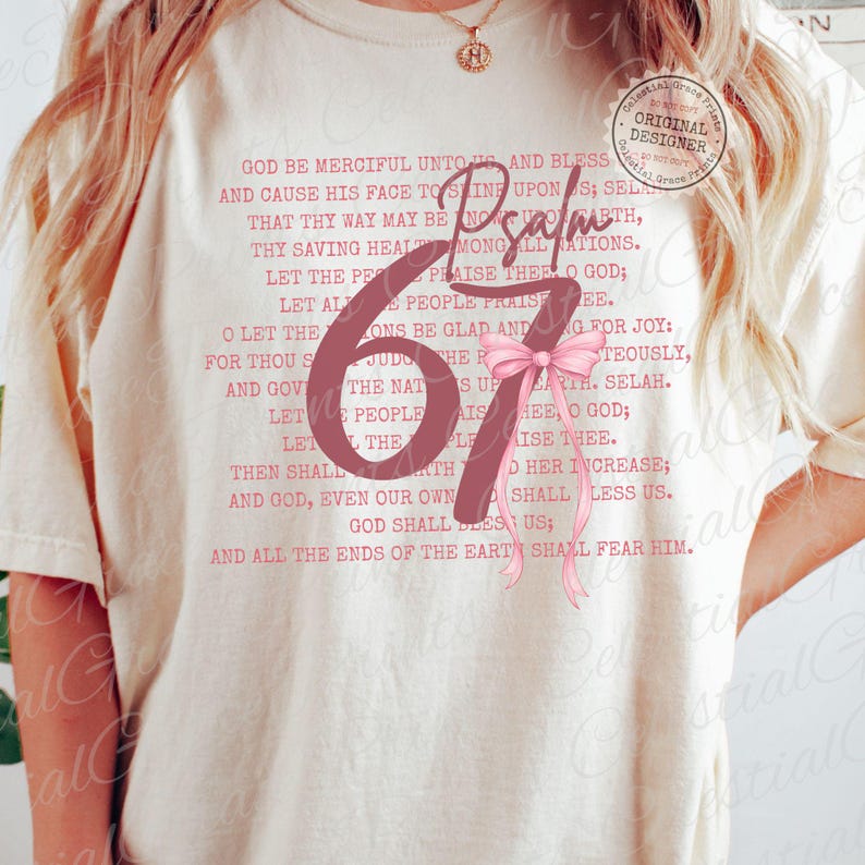 May include: Cream-colored t-shirt featuring the word "Psalm" and the number "67" in a soft pink hue, accompanied by a matching bow. The shirt also displays a religious verse in a delicate pink font, with a "Celestial Grace Prints" logo.