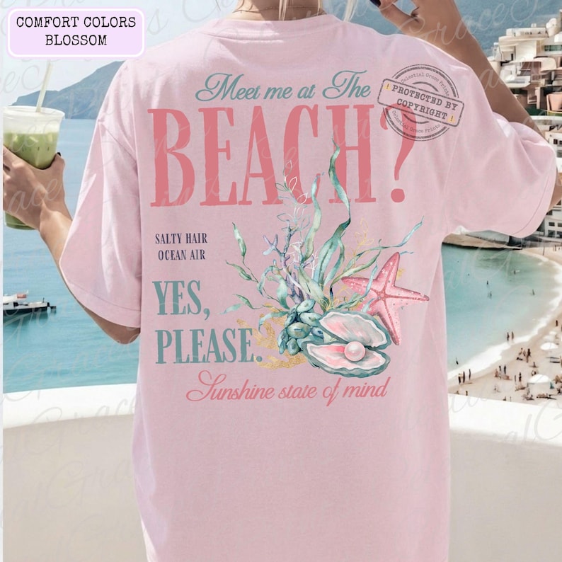 May include: Pale pink t-shirt with the words "Meet me at The BEACH?" and a seashell design. The shirt also has the phrases "Salty Hair Ocean Air" and "Yes, Please. Sunshine state of mind."