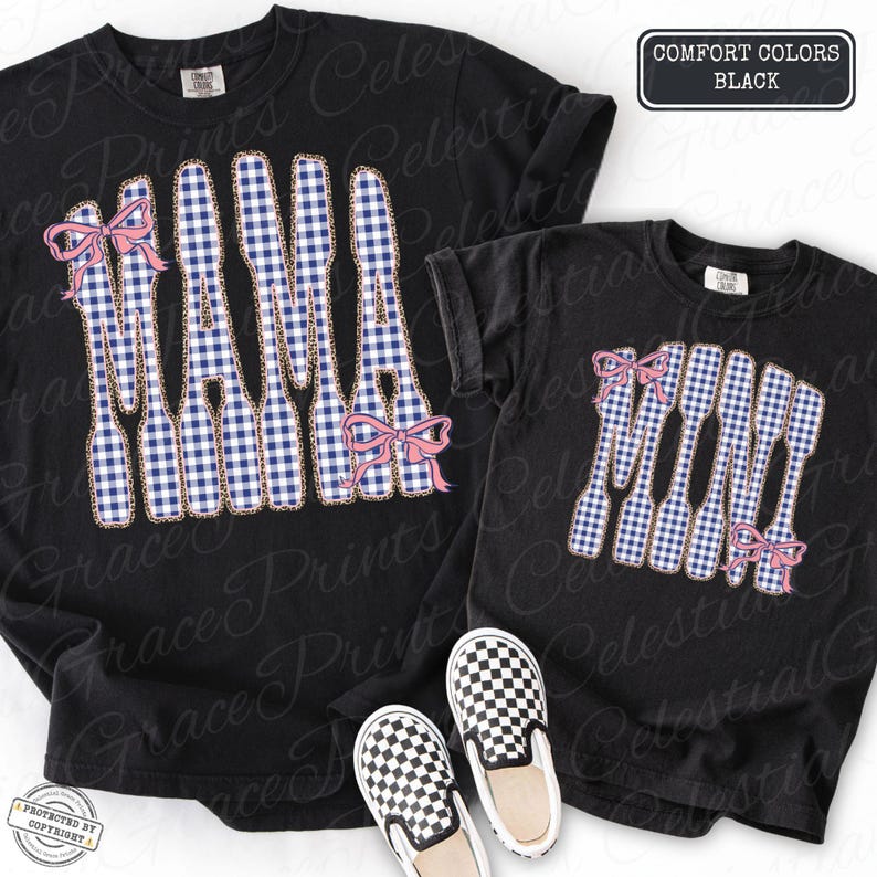 May include: Black t-shirts featuring a "MAMA" design in a blue and white gingham pattern, adorned with pink bows. The shirts are displayed with black and white checkered slip-on shoes. The text "COMFORT COLORS BLACK" is visible.