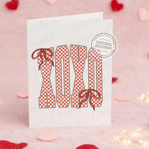 May include: A white greeting card with the letters "XOXO" in a red and white checkered pattern, accented with red bows. The letters have a leopard print outline. The card has a "Celestial Grace Prints" logo.