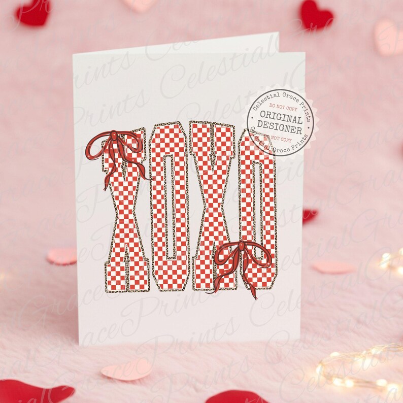 May include: A white greeting card with the letters "XOXO" in a red and white checkered pattern, accented with red bows. The letters have a leopard print outline. The card has a "Celestial Grace Prints" logo.