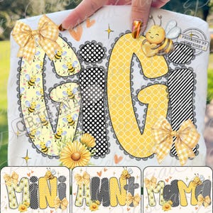 May include: A white t-shirt design featuring the word "GIGI" in a playful font with bee and floral patterns. Accents include a gingham bow, polka dots, and a sunflower. Additional designs include "MINI", "AUNT", and "MOM".