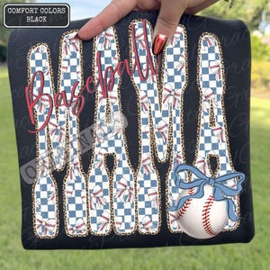 May include: Black t-shirt with the words "Baseball Mama" in a red script font. The letters are filled with a blue and white checkered pattern and baseballs. A baseball with a blue bow is on the bottom right.