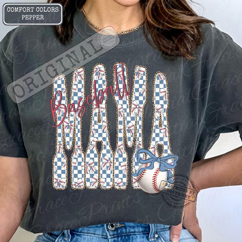 May include: Dark grey t-shirt with the words "Baseball Mama" in a unique design. The letters are filled with a blue and white checkered pattern, leopard print, and baseball stitching. A baseball with a blue bow is also featured.