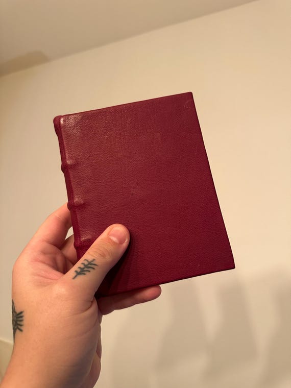 Genuinely medieval-style hand-bound journal using historical binding techniques — this isn't a pretty cover slapped on a notebook insert.