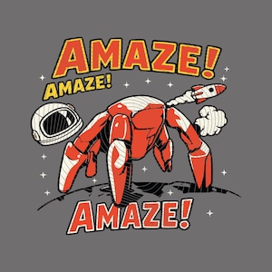 May include: A graphic illustration on a gray background featuring a red and white robot with a rocket attached to its back. An astronaut helmet sits to the left. The text AMAZE! appears in large orange letters at the top and bottom of the design.