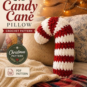 May include: A crochet pattern for a candy cane pillow featuring text that reads Candy Cane PILLOW CROCHET PATTERN, Christmas PATTERN, and PDF PATTERN. The image displays a plush, candy cane-shaped pillow with alternating red and white stripes.